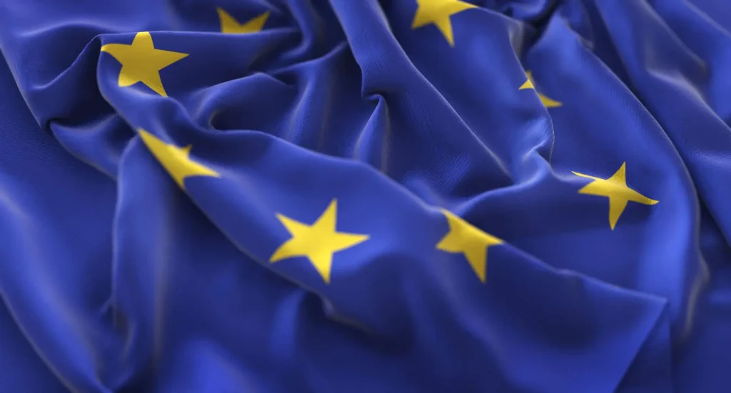 Normas Armonizadas: Qué son y tipología imagen de una bandera sobre la union europea y las normas armonizadas para comercializar